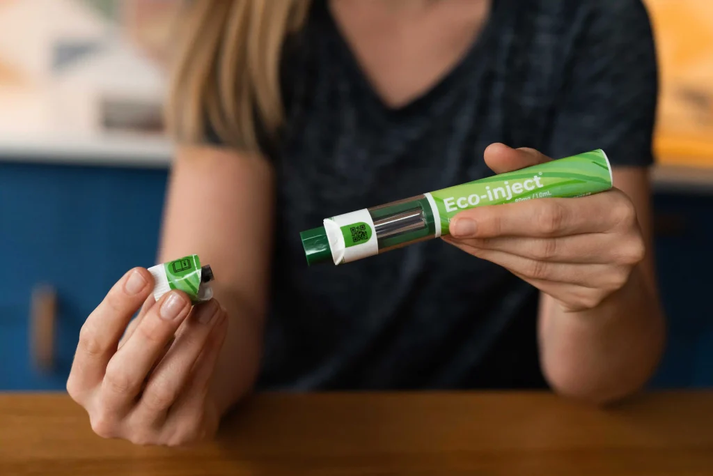 Image of person using autoinjector