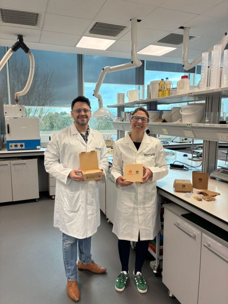 Image of two employees in a lab